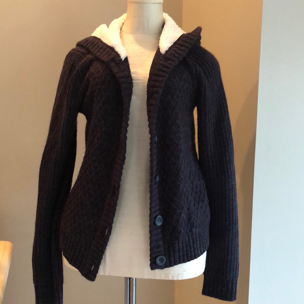 Charcoal grey sweater with fleece lined hood.